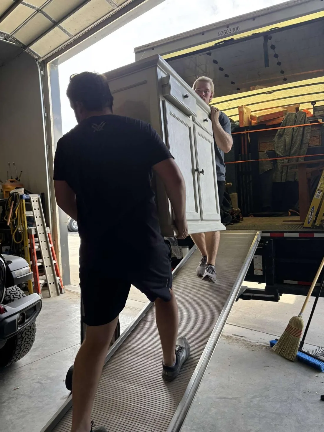 Moving a household cabinet toward a truck